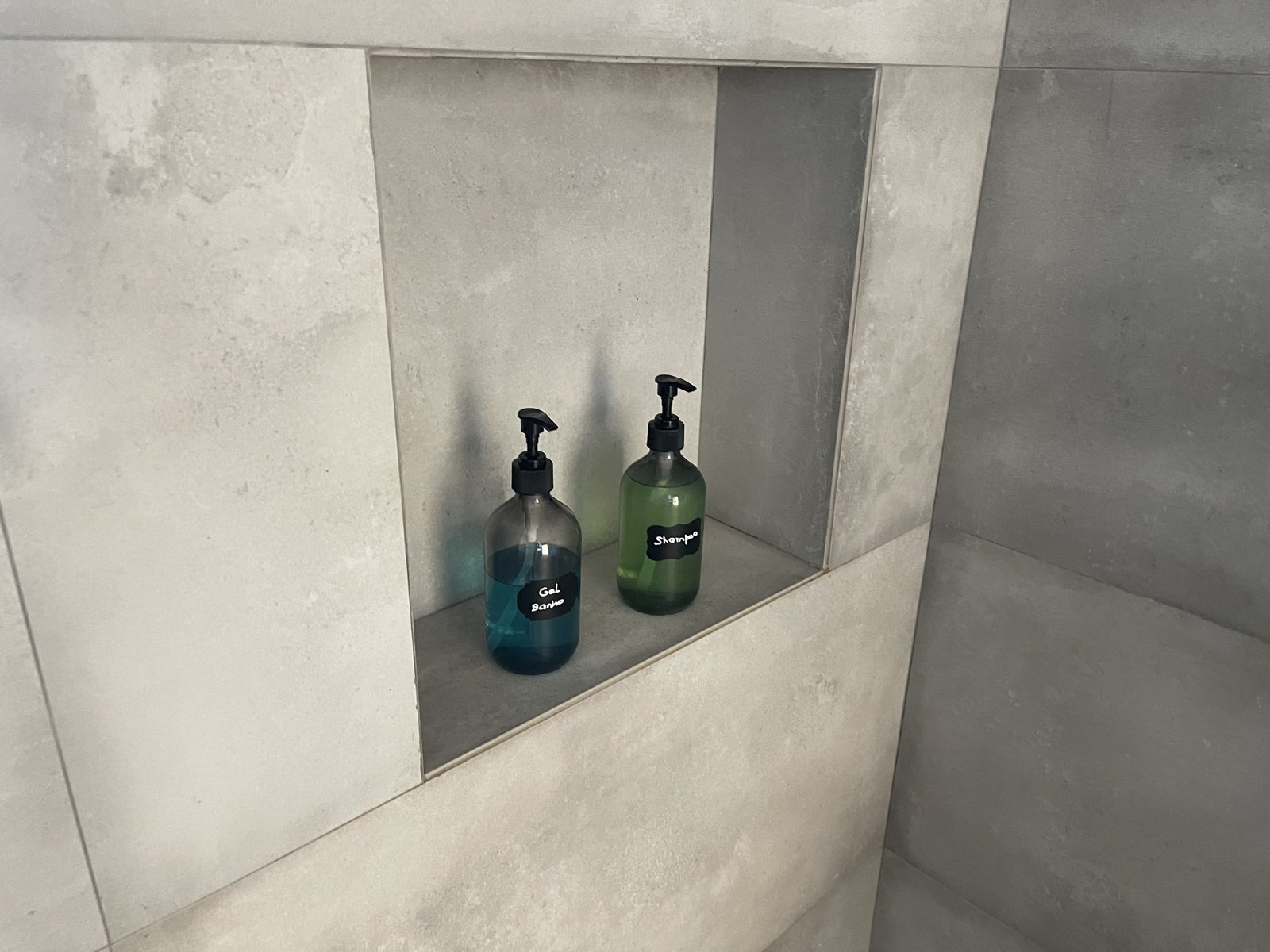 Walk-in shower niche with soap and shampoo dispensers at Guesthouse Olival, Madeira