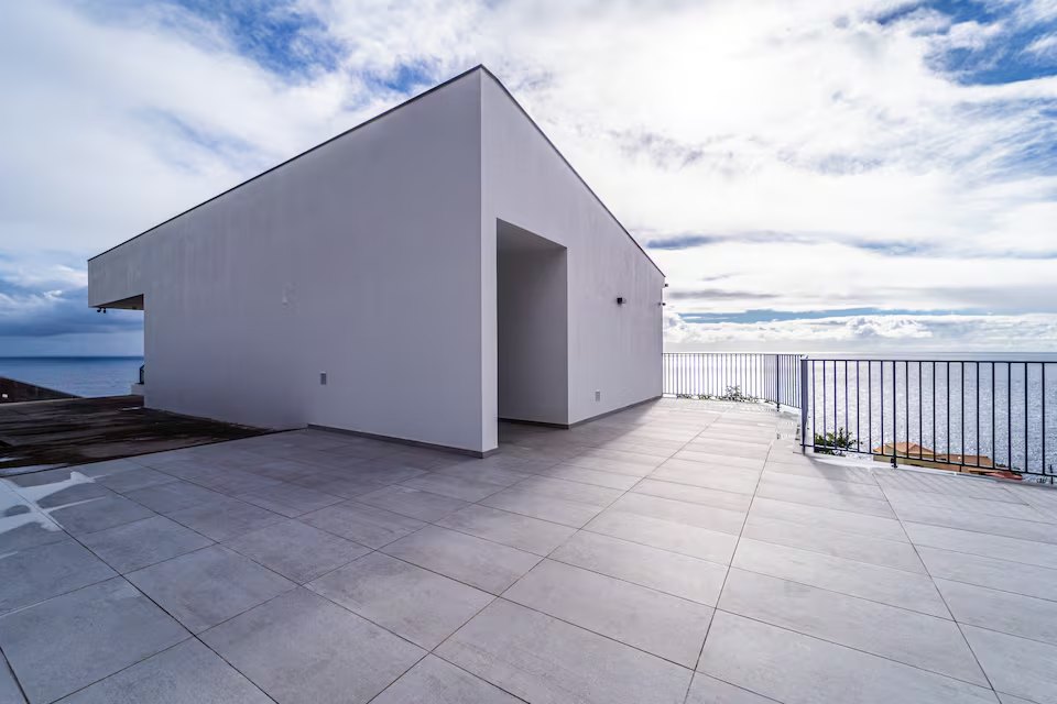 Large sea-facing private terrace and white modern apartment exterior at Guesthouse Olival, Gaula